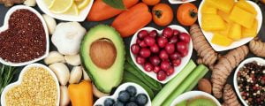 An array of a healthy diet food ingredients for total wellbeing, weight loss support and diabetes mangement, such as avocado, tomato, celery and ginger