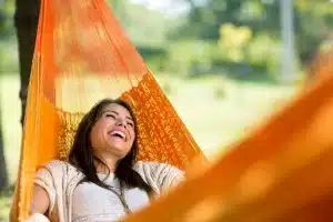 woman-laughing-orange-hammock-300x200jpg » HCi A group of people standing in a row and checking their phones for direct debit details for premium payments » HCi » HCi