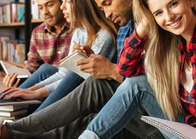 A row of young adults, happy to be on HCi family cover while 23-31
