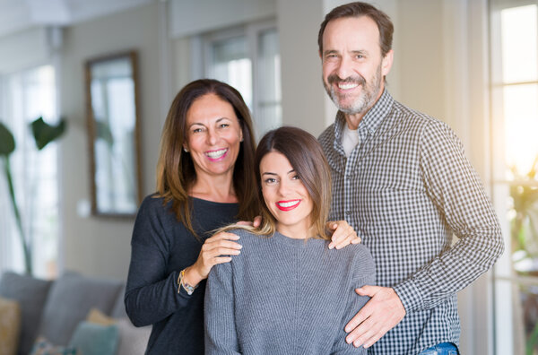 Mumm and Dad with their adult dependant daughter, smiling about health care, medical capacity and medical privacy